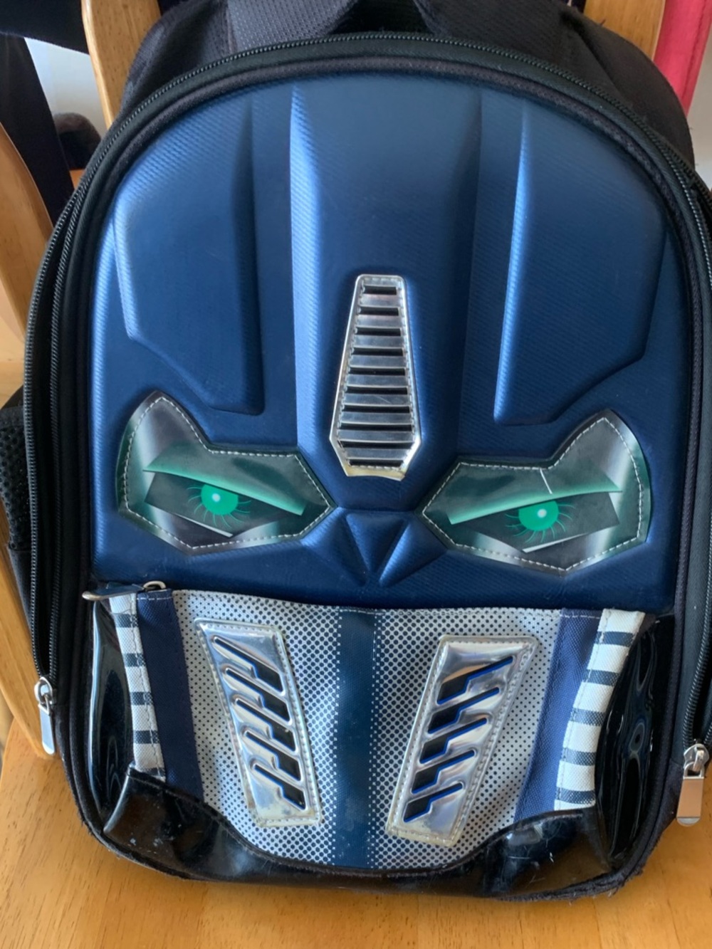 Blue Robot Face Kids Backpack lights up when you move it